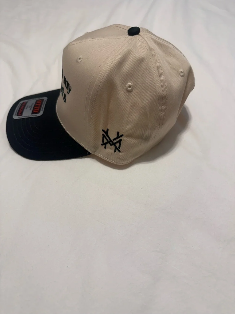 New Era Beige Crown Black Brim Snapback Hat with Embroidered Slogan